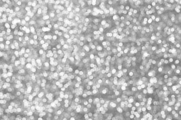istock Sillver bokeh texture. Festive glitter background with defocused 496075162