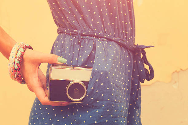 istock Hipster girl with old camera. 496075856