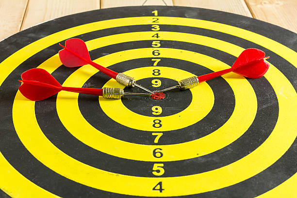 istock Red and blue dart arrow on dartboard 496076138