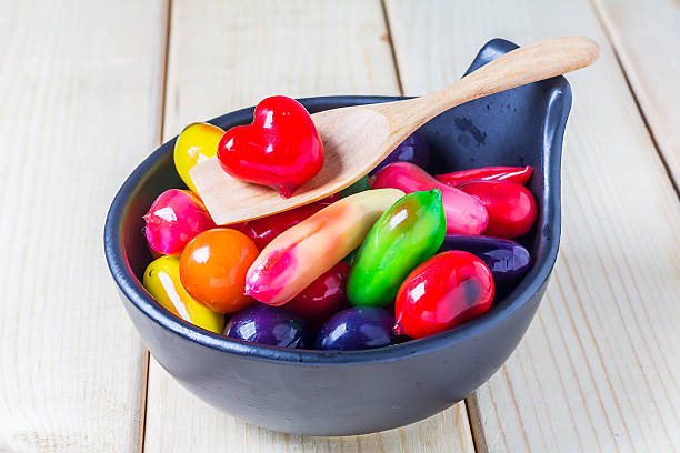 istock Deletable imitation fruits in bowl on wood background 496092648