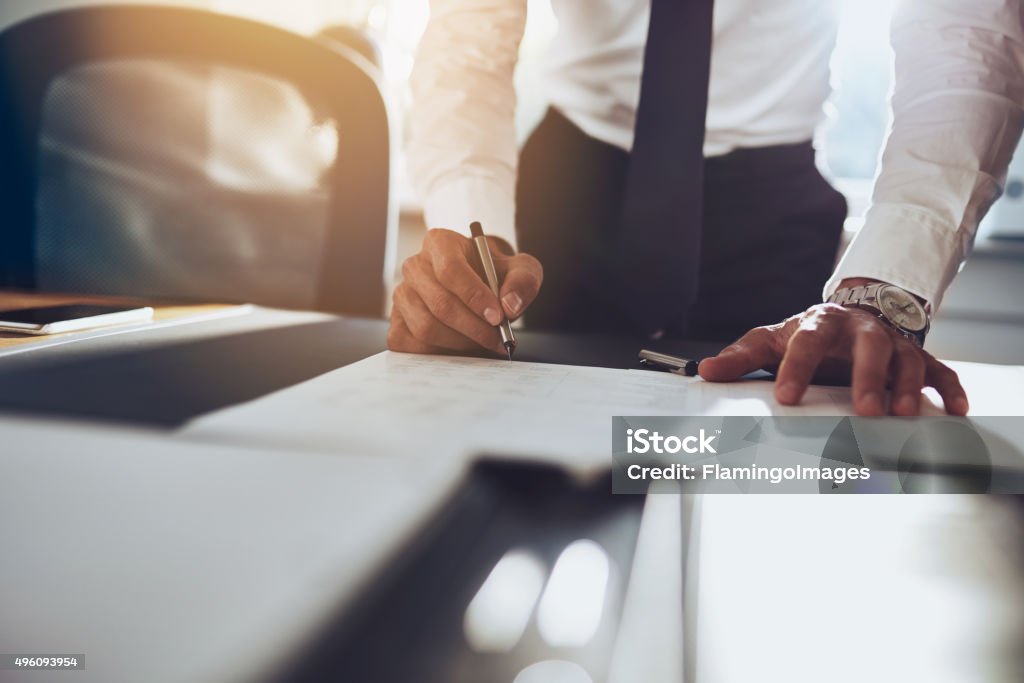 Close up business man signing contract Close up business man signing contract making a deal, classic business Legal System Stock Photo