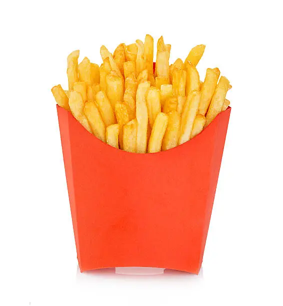 Photo of Potatoes fries in a red carton box isolated. Fast Food.