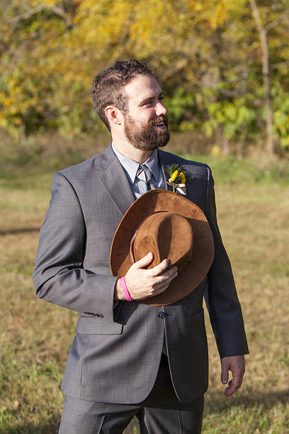 istock Groom with Cowboy Hat Over Heart 496094434