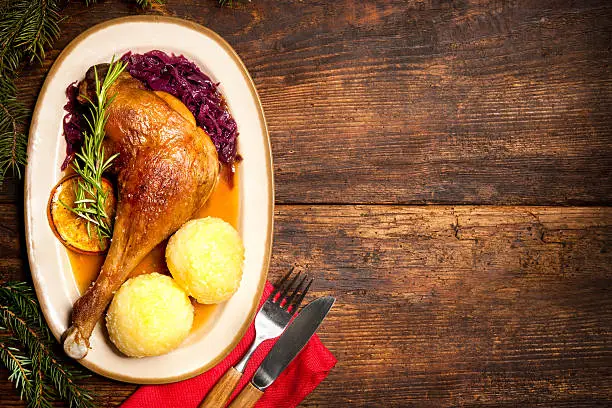 Photo of Crusty goose leg with braised red cabbage and dumplings