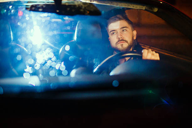 istock young man driving his modern sport car 496098926