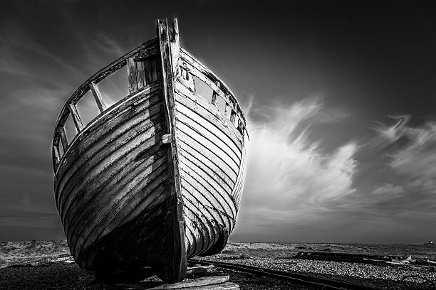 istock Abandoned Wooden Boat Wreck On Deserted Beach 496099246