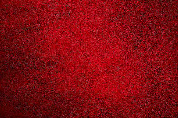 istock Red textured background with bright center spotlight and dark vi 496101602