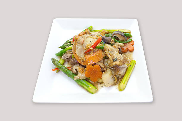 istock Fried noodle in gravy with seafood and fresh vegetable 496103096
