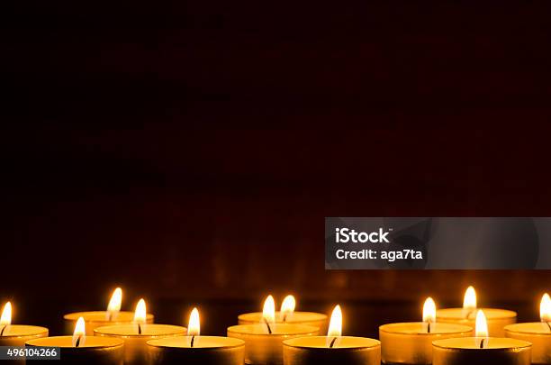 Burning Candles In Darkness Stock Photo - Download Image Now - Candle, Backgrounds, Candlelight