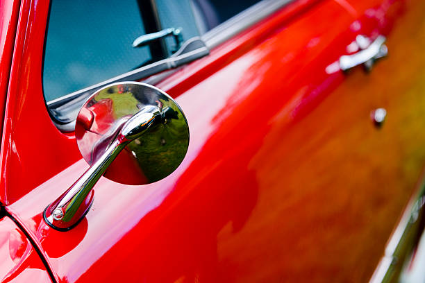 istock Classic car mirror on a red car 496107048
