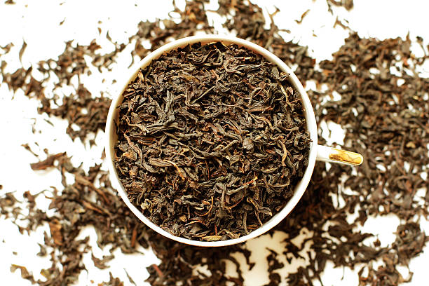 istock Cup with dried tea leaves top view 496109197