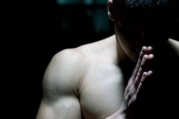 Muscular Man Praying stock photo