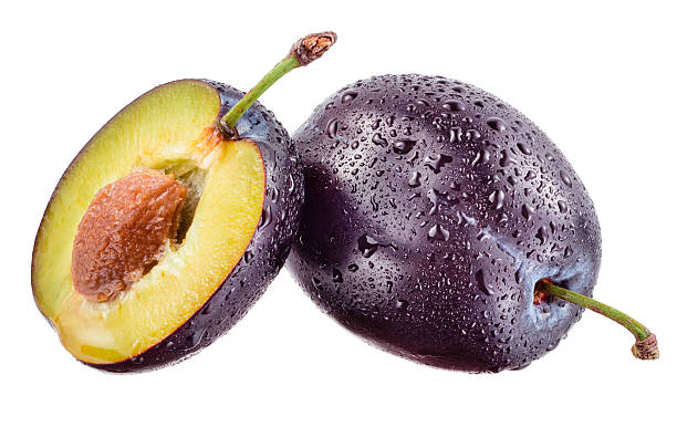 istock Plum and a half with drops isolated on white 496111505