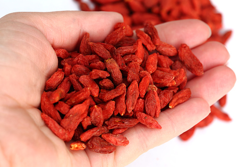 Goji berries, close up, in the palm of a hand.Goji berries, close up.