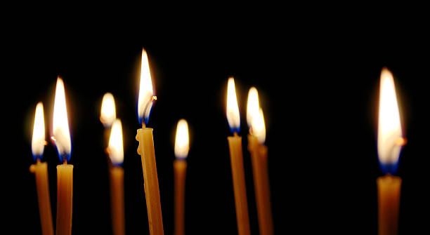 istock lot of thin burning candles 496113323