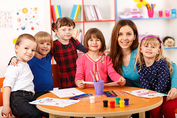 istock Group Of Elementary Age Children In Art Class With Teacher 496113385