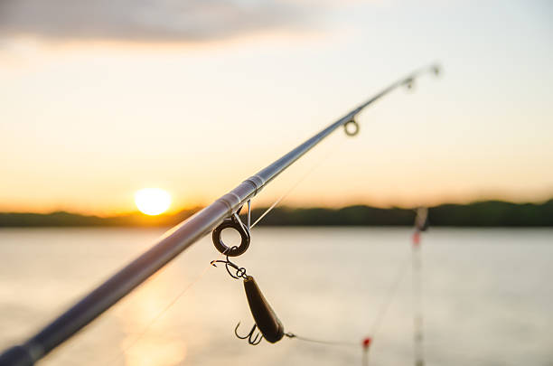 istock fishing on a lake before sunset 496113943
