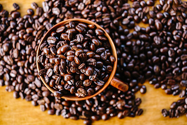 istock coffee bean and wooden cup 496117018