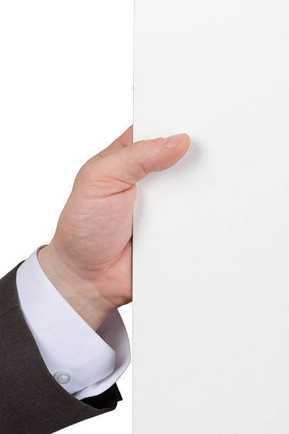 istock Businessman holding edge of blank paper 496119976