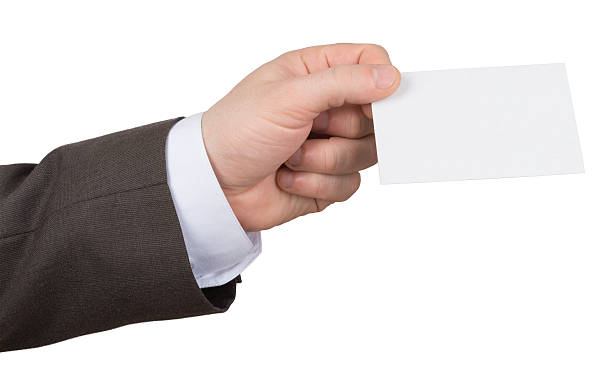istock Mans hand holding edge of empty paper 496120074