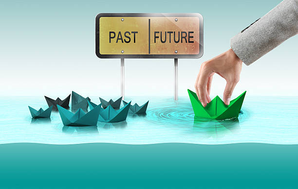 istock Helping hand tow paper boat from group to future 496122440