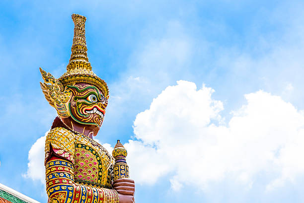 Giant Buddha in Wat Phra Kaeo, Temple of the Emerald Buddha and the home of the Thai King. Wat Phra Kaeo is one of Bangkok's most famous tourist sites and it was built in 1782 at Bangkok, Thailand.