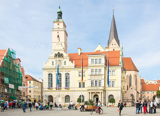 Tourists in Ingolstadt Ingolstadt, Germany - October 3, 2015: Tourists at the historic town hall of Ingolstadt. Foto taken from Moritzstrasse with view to the town hall. ingolstadt stock pictures, royalty-free photos & images