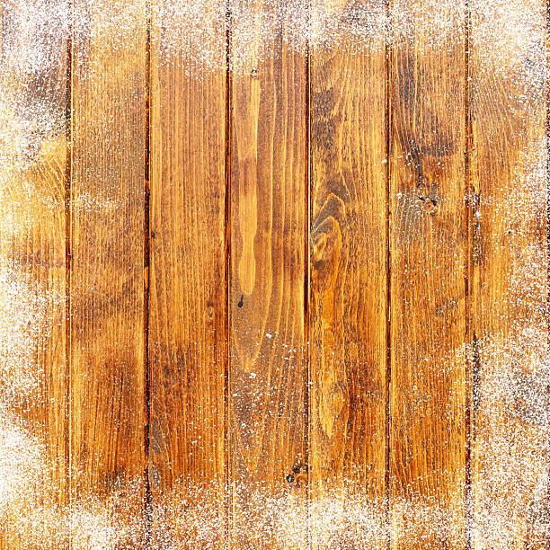 istock Old wooden background with snow flakes.Christmas background 496124640