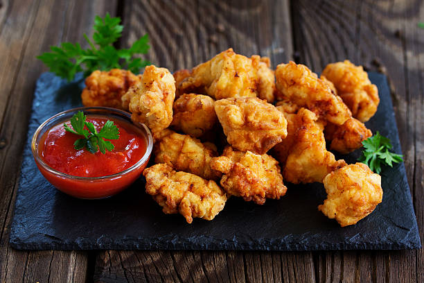 istock Fried nuggets of chicken breast with sauce. 496125550