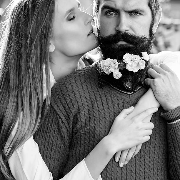 istock Girl and man with flowers on beard 496130448