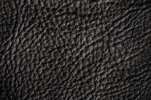 Closeup of a seamless black leather texture