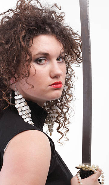 istock piercing woman curly girl and sword 496154628