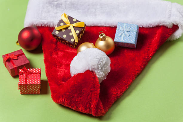 istock Santa Claus hat and christmas baubles 496155394
