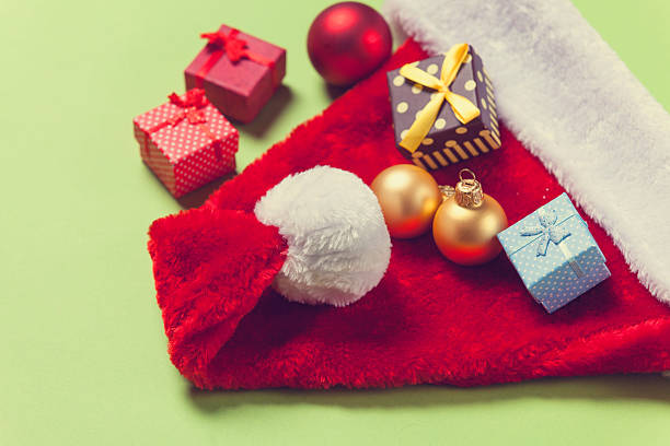 istock Santa Claus hat and christmas baubles 496155434