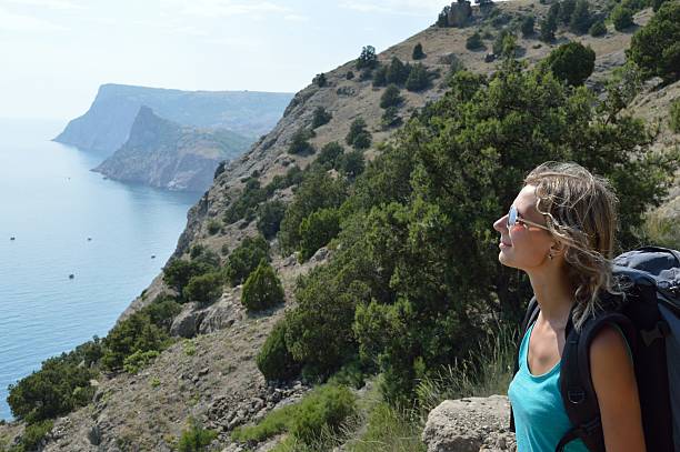 istock Tourist girl in mountains 496155805