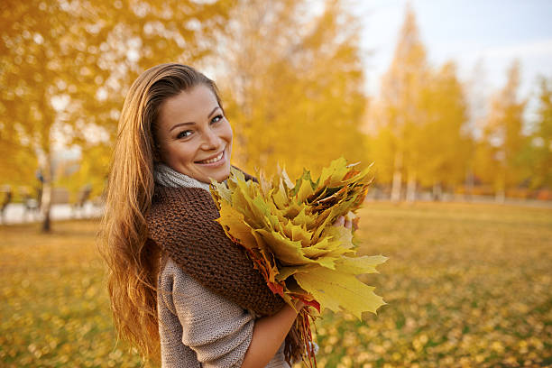 istock Young woman enjoying an autumn 496156578