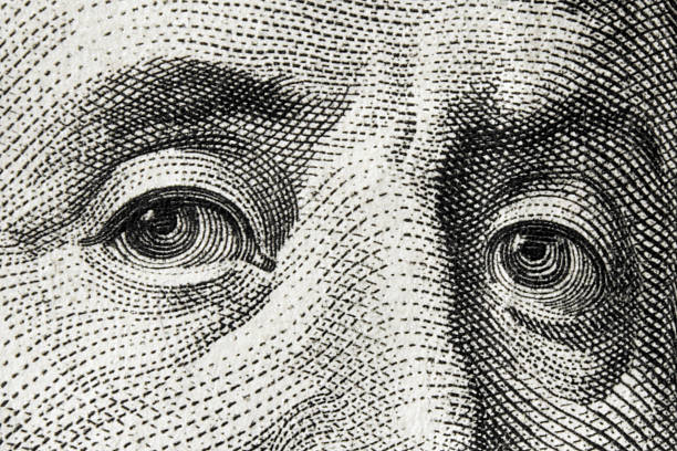 istock close up of dollar bill (eyes, bill, engraving - conceptually) 496157018