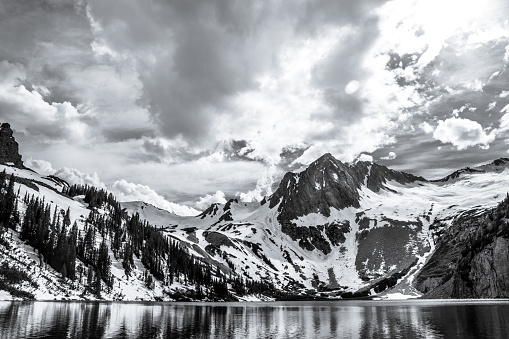 Dramatic Rocky Mountains Landscape Black and White. this rugged jagged Mountain landscape is set outside of Snowmass and Aspen , Colorado . in The Elk range of the Rocky Mountains these mountains , hagerman's and Snowmass Mountain are some of the most remote and dramatic peaks in this area. 