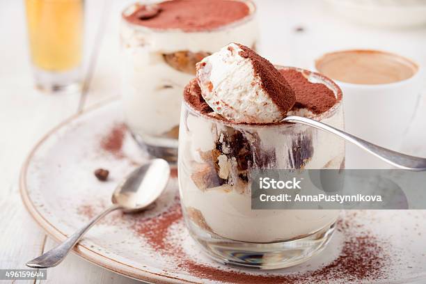 Tiramisu Dessert In A Glass Traditional Italian Stock Photo - Download Image Now - Tiramisu, Spoon, Drinking Glass