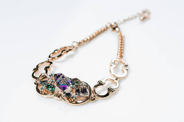 istock golden bracelet with precious stones on grey background 496159652