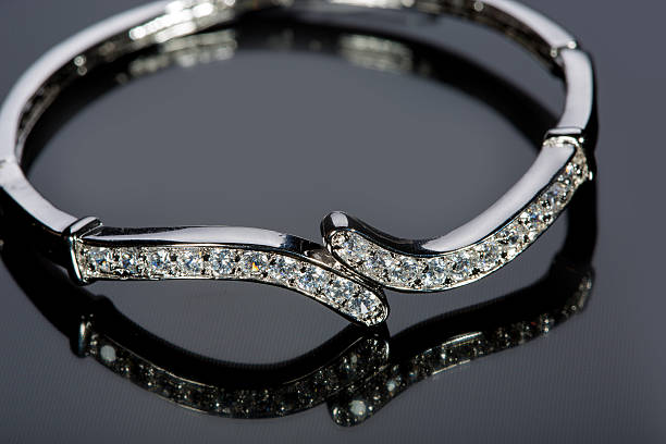 istock golden bracelet with precious stones on grey background 496160326