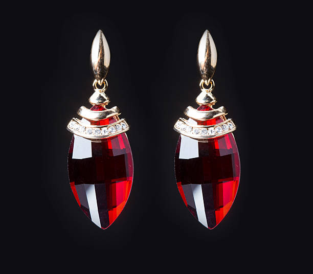 istock earring with colorful red gems on black background 496162472