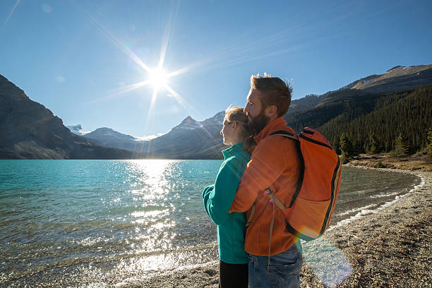 istock Young cheerful couple by the lake being affectionate. 496162498
