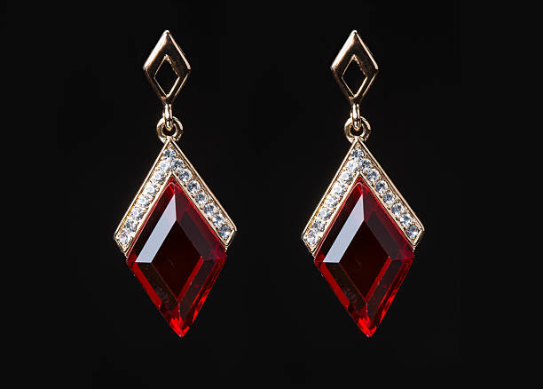 istock earring with colorful red gems on black background 496162508