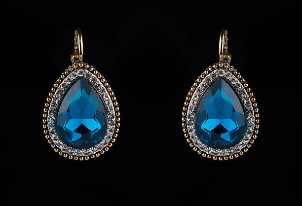 istock earring with colorful blue gems on black background 496163426