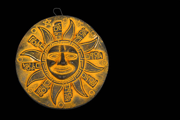 istock Mexican yellow ceramic sun souvenir isolated on black 496164030