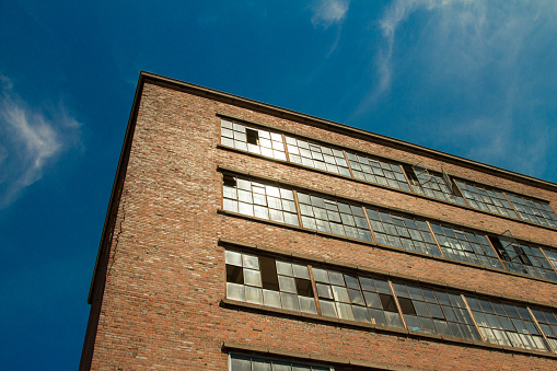 Old Factory with blue sky and Sun Reflection