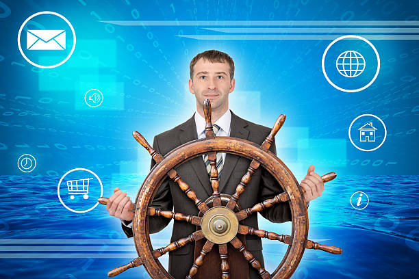 istock Smiling man with steering wheel and computer icons 496165188