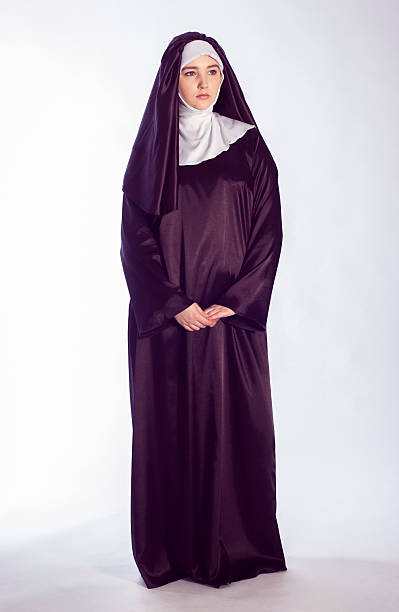 Catholic nun Full growth photo of catholic nun on white background. nun catholicism sister praying stock pictures, royalty-free photos & images