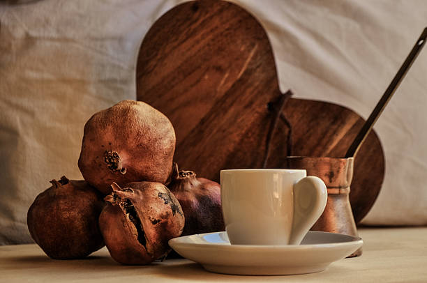greek coffee and pomegranate in atmospheric light